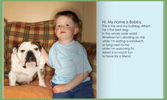 Little boy and bulldog sitting on couch 