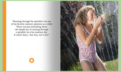 Young girl in water sprinkler 